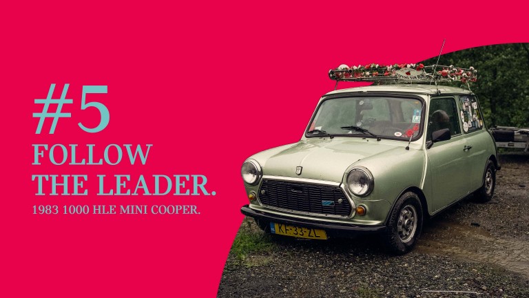 Pictured at the IMM 2024, mtallic light green 1983 1000 HLE Mini Cooper with a “flower crown” ring fixed above the roof, titled “#5 Follow the leader.”