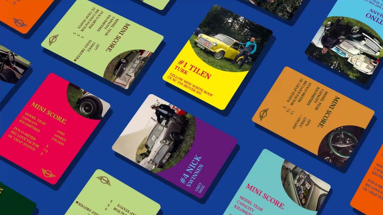 Selection of Top MINI cars in a playing card format laid out on a blue background.